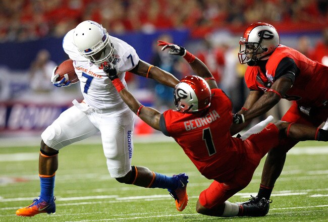 ATLANTA, GA - SEPTEMBER 03:  Branden Smith #1 of the Georgia Bulldogs is called for a facemask while tackling D.J. Harper #7 of the Boise State Broncos at Georgia Dome on September 3, 2011 in Atlanta, Georgia.  (Photo by Kevin C. Cox/Getty Images)