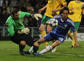 ZILINA, SLOVAKIA - SEPTEMBER 15:  Martin Dubravka of MSK Zilina clashes with Yossi Benayoun of Chelsea during the UEFA Champions League Group F match between MSK Zilina and Chelsea at the Pod Dubnom Stadium on September 15, 2010 in Zilina, Slovakia.  (Pho