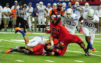 ATLANTA - SEPTEMBER 3: Aaron Murray #11 of the Georgia Bulldogs is sacked by Tyrone Crawford #40 of the Boise State Broncos during the Chick-Fil-A Kickoff Game at the Georgia Dome on September 3, 2011 in Atlanta, Georgia. Photo by Scott Cunningham/Getty I