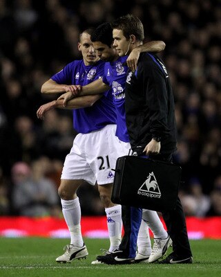 LIVERPOOL, ENGLAND - MARCH 09:  Mikel Arteta of Everton is helped off the pitch with an injury during the Barclays Premier League match between Everton and Birmingham City at Goodison Park on March 9, 2011 in Liverpool, England.  (Photo by Alex Livesey/Ge
