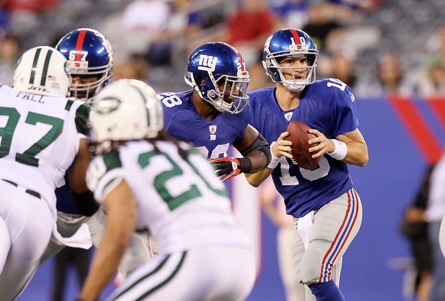 EAST RUTHERFORD, NJ - AUGUST 29:  Eli Manning #10 of the New York Giants in action against the New York Jets during their pre season game on August 29, 2011 at MetLife Stadium in East Rutherford, New Jersey.  (Photo by Jim McIsaac/Getty Images)