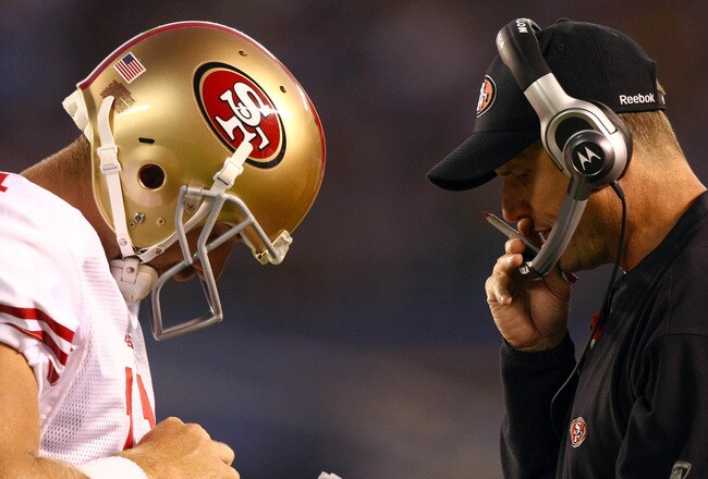 SAN DIEGO, CA - SEPTEMBER 1:  Head Coach Jim Harbaugh of the San Francisco 49ers speaks with Starting Quarterback Alex Smith #11 on the field during their preseason NFL Game against  the San Diego Chargers on September 1, 2011 at Qualcomm Stadium in San D