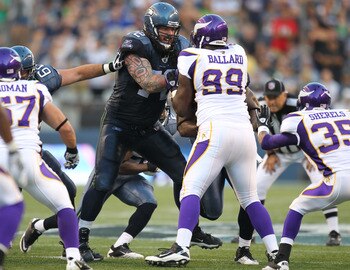 Seattle Seahawks offensive lineman Robert Gallery takes on a Minnesota defender.