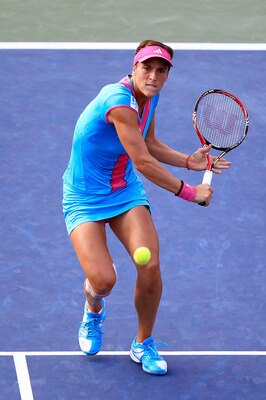 NEW YORK, NY - SEPTEMBER 05:  Andrea Petkovic of Germany returns a shot against  Carla Suarez Navarro of Spain during Day Eight of the 2011 US Open at the USTA Billie Jean King National Tennis Center on September 5, 2011 in the Flushing neighborhood of th