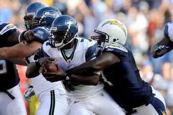SAN DIEGO, CA - AUGUST 11:  Quarterback Tarvaris Jackson #7 of the Seattle Seahawks is sacked by Ogemdi Nwagbuo #91 of the San Diego Chargers in the second quarter during the NFL preseason game at Qualcomm Stadium on August 11, 2011 in San Diego, Californ