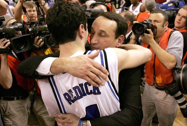 GREENSBORO, NC - MARCH 12:  J.J. Redick #4 embraces embraces coach Mike Krzyzewski of the Duke Blue Devils as they celebrate after a 78-76 win over the Boston College Eagles during the finals of the Atlantic Coast Conference Men's Basketball Tournament on