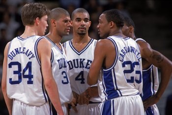 17 Mar 2000: Mike Dunleavy #34 of the Duke Blue Devils listens to Chris Carrawell #23 with Carlos Boozer #4 and Shane Battier #31 during the first round of the NCAA Tournament Game against the Lamar Cardinals at the Lawrence Joel Coliseum in Winston Salem
