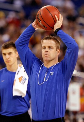 INDIANAPOLIS - APRIL 02:  Associate coach Steve Wojciechowski of the Duke Blue Devils passes the ball during practice prior to the 2010 Final Four of the NCAA Division I Men's Basketball Tournament at Lucas Oil Stadium on April 2, 2010 in Indianapolis, In