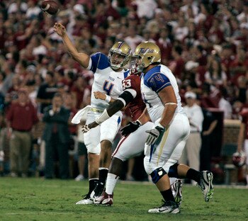 NORMAN, OK - SEPTEMBER 3:  Quarterback G.J. Kinne #4 of the Tulsa Hurricanes throws during the first half of the college football game against the Oklahoma Sooners on September 3, 2011 at Gaylord Family-Oklahoma Memorial Stadium in Norman, Oklahoma.  Okla