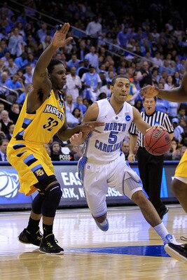 NEWARK, NJ - MARCH 25:  Kendall Marshall #5 of the North Carolina Tar Heels in action against Jae Crowder #32 of the Marquette Golden Eagles during the east regional semifinal of the 2011 NCAA Men's Basketball Tournament at the Prudential Center on March