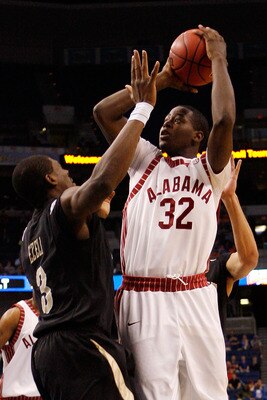 TAMPA, FL - MARCH 12:  Jamychal Green #32 of the Alabama Crimson Tide makes a shot over Festus Ezeli #3 of the Vanderbilt Commodores during the first round of the SEC Men's Basketball Tournament on March 12, 2009 at The St. Pete Times Forum in Tampa, Flor