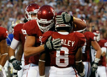 NORMAN, OK - SEPTEMBER 3:  Offensive tackle Lane Johnson #69 of the Oklahoma Sooners congratulates running back Dominique Whaley #8 after a touchdown during the first half against the Tulsa Hurricanes September 3, 2011 at Gaylord Family-Oklahoma Memorial