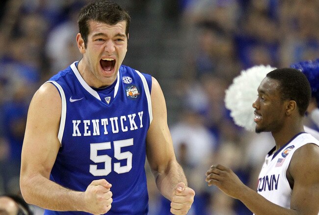 HOUSTON, TX - APRIL 02:  Josh Harrellson #55 of the Kentucky Wildcats reacts after a play as Kemba Walker #15 of the Connecticut Huskies looks on during the National Semifinal game of the 2011 NCAA Division I Men's Basketball Championship at Reliant Stadi