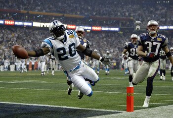 HOUSTON, TX - FEBRUARY 1:  Running back DeShaun Foster #20 of the Carolina Panthers scores on a 33 yard touchdown run against the New England Patriots during Super Bowl XXXVIII at Reliant Stadium on February 1, 2004 in Houston, Texas. (Photo by Brian Bahr
