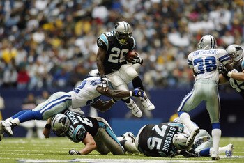 IRVING, TEXAS - OCTOBER 13:  Running back Lamar Smith #26 of the Carolina Panthers vaults over a defender during the NFL game against the Dallas Cowboys at Texas Stadium on October 13, 2002 in Irving, Texas.   The Cowboys defeated the Panthers 14-13.  (Ph