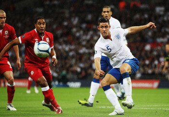 LONDON, ENGLAND - SEPTEMBER 06:  Gary Cahill of England clears the ball during the UEFA EURO 2012 group G qualifying match between England and Wales at Wembley Stadium  on September 6, 2011 in London, England.  (Photo by Bryn Lennon/Getty Images)