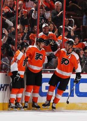 PHILADELPHIA - MARCH 05:  James van Riemsdyk #21 of The Philadelphia Flyers celebrates his goal with Claude Giroux #28 and Blair Betts #11 against the Buffalo Sabresduring their game on March 5, 2011 at The Wells Fargo Center in Philadelphia, Pennsylvania