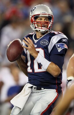 FOXBORO, MA - SEPTEMBER 01:   Tom Brady #12 of the New England Patriots looks to pass in the first half against the New York Giants on September 1, 2011 at Gillette Stadium in Foxboro, Massachusetts.  (Photo by Elsa/Getty Images)