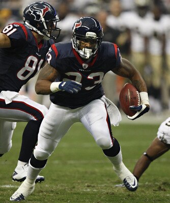 HOUSTON - AUGUST 20:  Running back Arian Foster #23 of the Houston Texans rushes against the New Orleans Saints in the first quarter at Reliant Stadium on August 20, 2011 in Houston, Texas.  (Photo by Bob Levey/Getty Images)