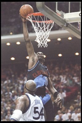 19 Apr 1996:  Forward Tyrone Hill of the Cleveland Cavaliers shoots the ball as forward Horace Grant of the Orlando Magic watches him during a game at the Orlando Arena in Orlando, Florida.  The Magic won the game 116-104. Mandatory Credit: Allsport  /All