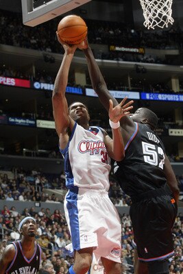 LOS ANGELES - OCTOBER 30:  Michael Olowokandi #34 of the Los Angeles Clippers attempts a shot over DeSagana Diop #52 of the Cleveland Cavaliers during the game at Staples Center on October 30, 2002 in Los Angeles, California.  The Cavaliers won 98-96.  NO