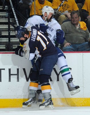 NASHVILLE, TN - MAY 05:   David Legwand #11 of the Nashville Predators checks Cody Hodgson #39 of the Vancouver Canucks in Game Four of the Western Conference Semifinals at Bridgestone Arena on May 5, 2011 in Nashville, Tennessee.  (Photo by Frederick Bre