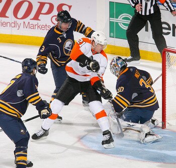 BUFFALO, NY - APRIL 24: James van Riemsdyk #21 of the Philadelphia Flyers is stopped in the crease by Ryan Miller #30 of the Buffalo Sabres  in Game Six of the Eastern Conference Quarterfinals during the 2011 NHL Stanley Cup Playoffs at HSBC Arena at HSBC