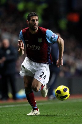BIRMINGHAM, ENGLAND - JANUARY 22:  Carlos Cuellar of Aston Villa runs with the ball during the Barclays Premier League match between Aston Villa and Manchester City at Villa Park on January 22, 2011 in Birmingham, England.  (Photo by Ian Walton/Getty Imag
