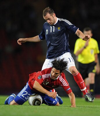 GLASGOW, SCOTLAND - SEPTEMBER 07:  James McFadden of Scotland tackles Michele Polverino of Liechtenstein during the UEFA Euro 2012 Group I Qualifying match between Scotland and Liechtenstein at Hampden Park on September 7, 2010 in Glasgow, Scotland.  (Pho