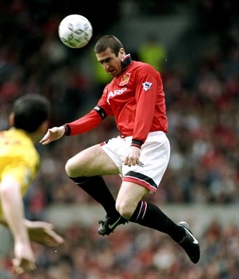 28 Apr 1996:  Eric Cantona of Manchester United jumps high for the ball during an FA Carling Premiership match against Nottingham Forest at Old Trafford in Manchester, England. Manchester United won the match 5-0. \ Mandatory Credit: Shaun  Botterill/Alls