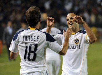 CARSON, CA - AUGUST 20:  Landon Donovan #10 of the Los Angeles Galaxy celebrates the goal of Mike Magee #18 for a 2-0 lead over the San Jose Earthquakes during the second half at The Home Depot Center on August 20, 2011 in Carson, California.  (Photo by H