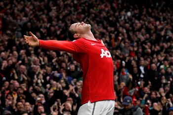 MANCHESTER, ENGLAND - FEBRUARY 12:  Wayne Rooney of Manchester United celebrates after he scores a goal from an overhead kick during the Barclays Premier League match between Manchester United and Manchester City at Old Trafford on February 12, 2011 in Ma