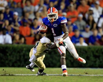 GAINESVILLE, FL - SEPTEMBER 10:  Chris Rainey #1 of the Florida Gators runs past Terrell Springs #29 of the UAB Blazers during a game at Ben Hill Griffin Stadium on September 10, 2011 in Gainesville, Florida.  (Photo by Sam Greenwood/Getty Images)