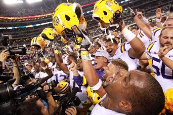 ARLINGTON, TX - SEPTEMBER 03:  Head coach Les Miles of the LSU Tigers celebrates with his team after defeating the Oregon Ducks at Cowboys Stadium on September 3, 2011 in Arlington, Texas.  (Photo by Ronald Martinez/Getty Images)