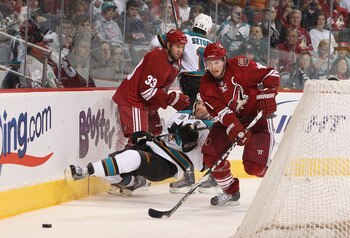 GLENDALE, AZ - MARCH 26:  Shane Doan #19 of the Phoenix Coyotes skates after a loose puck during the NHL game against the San Jose Sharks at Jobing.com Arena on March 26, 2011 in Glendale, Arizona.  The Sharks defeated the Coyotes 4-1.  (Photo by Christia