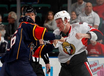 SUNRISE, FL - MARCH 31: Francis Lessard #49 of the Ottawa Senators and Darcy Hordichuk #16 of the Florida Panthers fight during the first period on March 31, 2011 at the BankAtlantic Center in Sunrise, Florida. (Photo by Joel Auerbach/Getty Images)