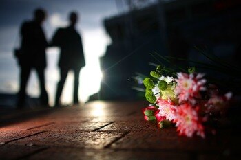 MANCHESTER, UNITED KINGDOM - FEBRUARY 06:  A bouquet of flowers lays next to a memorial stone to 'Busby Babe' Duncan Edwards, one of the victims of the the Munich disaster, as manchester United fans take part in a minutes silence on  February 6, 2008, Man