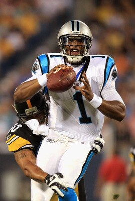 CHARLOTTE, NC - SEPTEMBER 01:  Larry Foote #50 of the Pittsburgh Steelers tries to tackle Cam Newton #1 of the Carolina Panthers during their preseason game at Bank of America Stadium on September 1, 2011 in Charlotte, North Carolina.  (Photo by Streeter