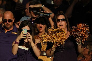 ARLINGTON, TX - SEPTEMBER 03:  Fans cheer before a game against the Oregon Ducks and the LSU Tigers at Cowboys Stadium on September 3, 2011 in Arlington, Texas.  (Photo by Ronald Martinez/Getty Images)