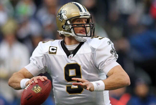 SEATTLE, WA - JANUARY 08:  Quarterback Drew Brees #9 of the New Orleans Saints scrambles against the Seattle Seahawks during the 2011 NFC wild-card playoff game at Qwest Field on January 8, 2011 in Seattle, Washington.  (Photo by Jonathan Ferrey/Getty Ima