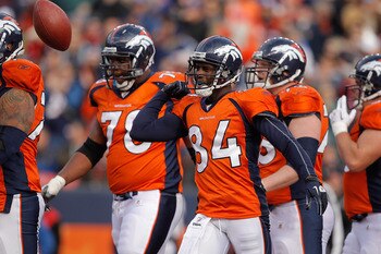 DENVER - NOVEMBER 14:  Wide receiver Brandon Lloyd #84 of the Denver Broncos celebrates 6-yard touchdown reception with teammates against the Kansas City Chiefs during the first quarter at INVESCO Field at Mile High on November 14, 2010 in Denver, Colorad