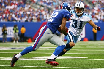 EAST RUTHERFORD, NJ - SEPTEMBER 26: Steve Smith #12 of the New York Giants runs the ball against Cortland Finnegan #31 of the Tennessee Titans at New Meadowlands Stadium on September 26, 2010 in East Rutherford, New Jersey. The Titans defeated the Giants