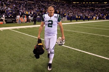 INDIANAPOLIS, IN - JANUARY 08:  Kicker Nick Folk #2 of  the New York Jets walks off the field after he kicked a game-winning 32-yard field goal as time expired to give the Jets a 17-16 win against the Indianapolis Colts during their 2011 AFC wild card pla