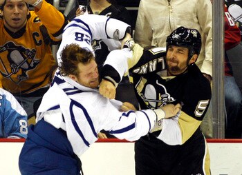 PITTSBURGH, PA - DECEMBER 08:  Deryk Engelland #5 of the Pittsburgh Penguins mixes it up against Colton Orr #28 of the Toronto Maple Leafs at Consol Energy Center on December 8, 2010 in Pittsburgh, Pennsylvania.  (Photo by Justin K. Aller/Getty Images)
