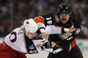 ANAHEIM, CA - JANUARY 07:  George Parros #16 of the Anaheim Ducks throws a punch at Jared Boll #40 of the Columbus Blue Jackets in the first period at the Honda Center on January 7, 2011 in Anaheim, California.  (Photo by Jeff Gross/Getty Images)