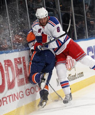 UNIONDALE, NY - DECEMBER 02: Brandon Prust #8 of the New York Rangers hits Dylan Reese #42 of the New York Islanders at the Nassau Coliseum on December 2, 2010 in Uniondale, New York.  (Photo by Bruce Bennett/Getty Images)