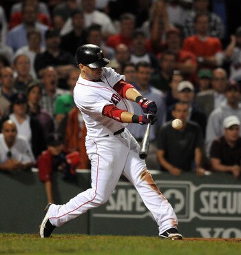 BOSTON, MA - SEPTEMBER 1:  Marco Scutaro #10 of the Boston Red Sox gets a hit in the ninth inning to fill the bases against the New York Yankees at Fenway Park on September 1, 2011 in Boston, Massachusetts. The Yankees won the game 4-2. (Photo by Darren M