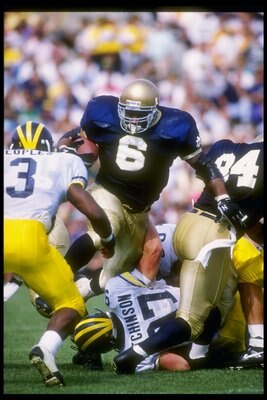 12 Sep 1992:  Fullback Jerome Bettis of the Notre Dame Fighting Irish tries to break through the Michigan Wolverines line during a game at Notre Dame Stadium in South Bend, Indiana.  Notre Dame won the game 17-17. Mandatory Credit: Jonathan Daniel  /Allsp