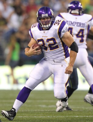 SEATTLE - AUGUST 20:  Running back Toby Gerhart #32 of the Minnesota Vikings rushes against the Seattle Seahawks at CenturyLink Field on August 20, 2011 in Seattle, Washington. The Vikings won 20-7. (Photo by Otto Greule Jr/Getty Images)