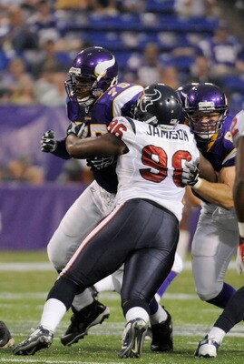 MINNEAPOLIS, MN - SEPTEMBER 01: DeMarcus Love #75 and Kyle Rudolph #82 of the Minnesota Vikings battle for position against Tim Jamison #96 of the Houston Texans in the first half on September 1, 2011 at Hubert H. Humphrey Metrodome in Minneapolis, Minnes
